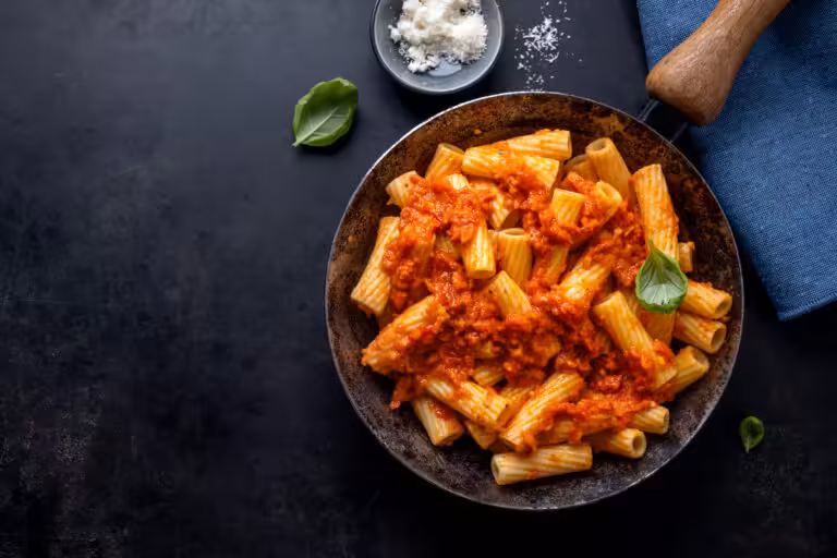Pasta with tomato sauce served on pan
